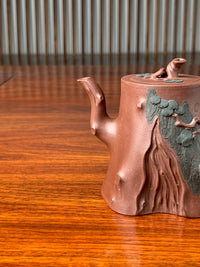 The tree-branch-shaped spout of the teapot
