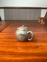 the right view of the teapot artwork on the table