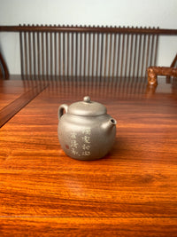 the left view of the teapot artwork on the table