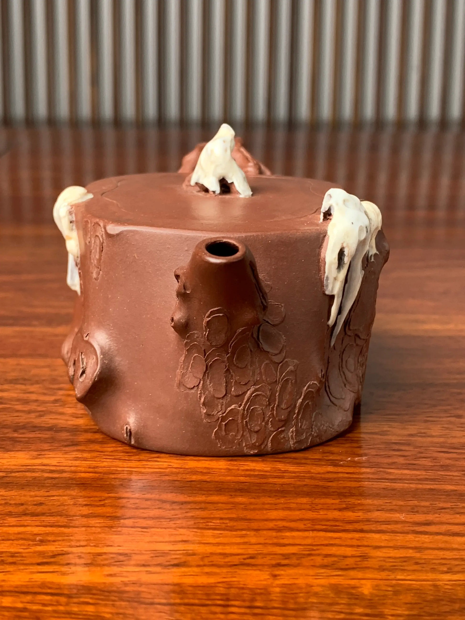 the front view of the collectible teapot on the table