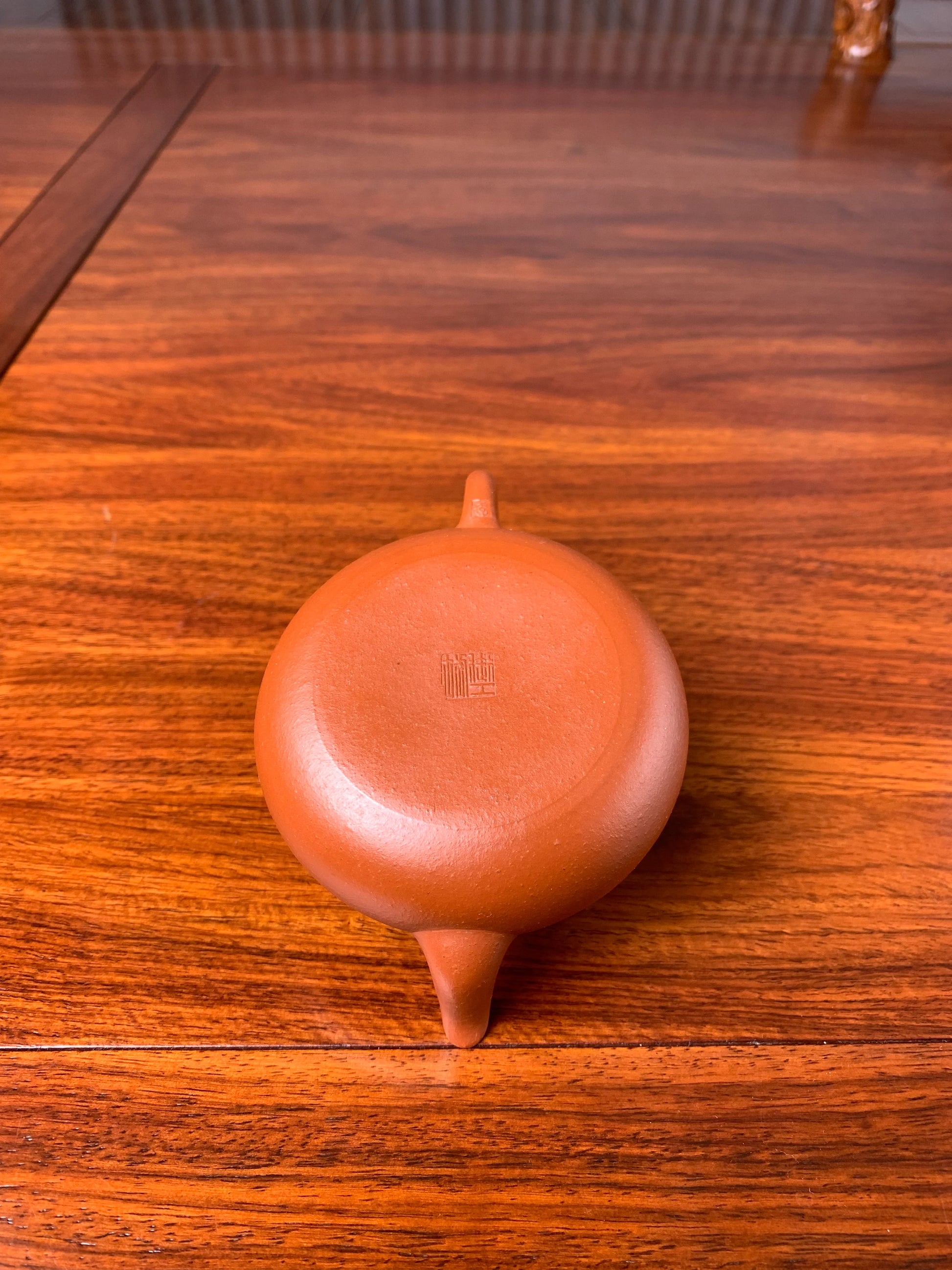 The bottom of this handmade teapot