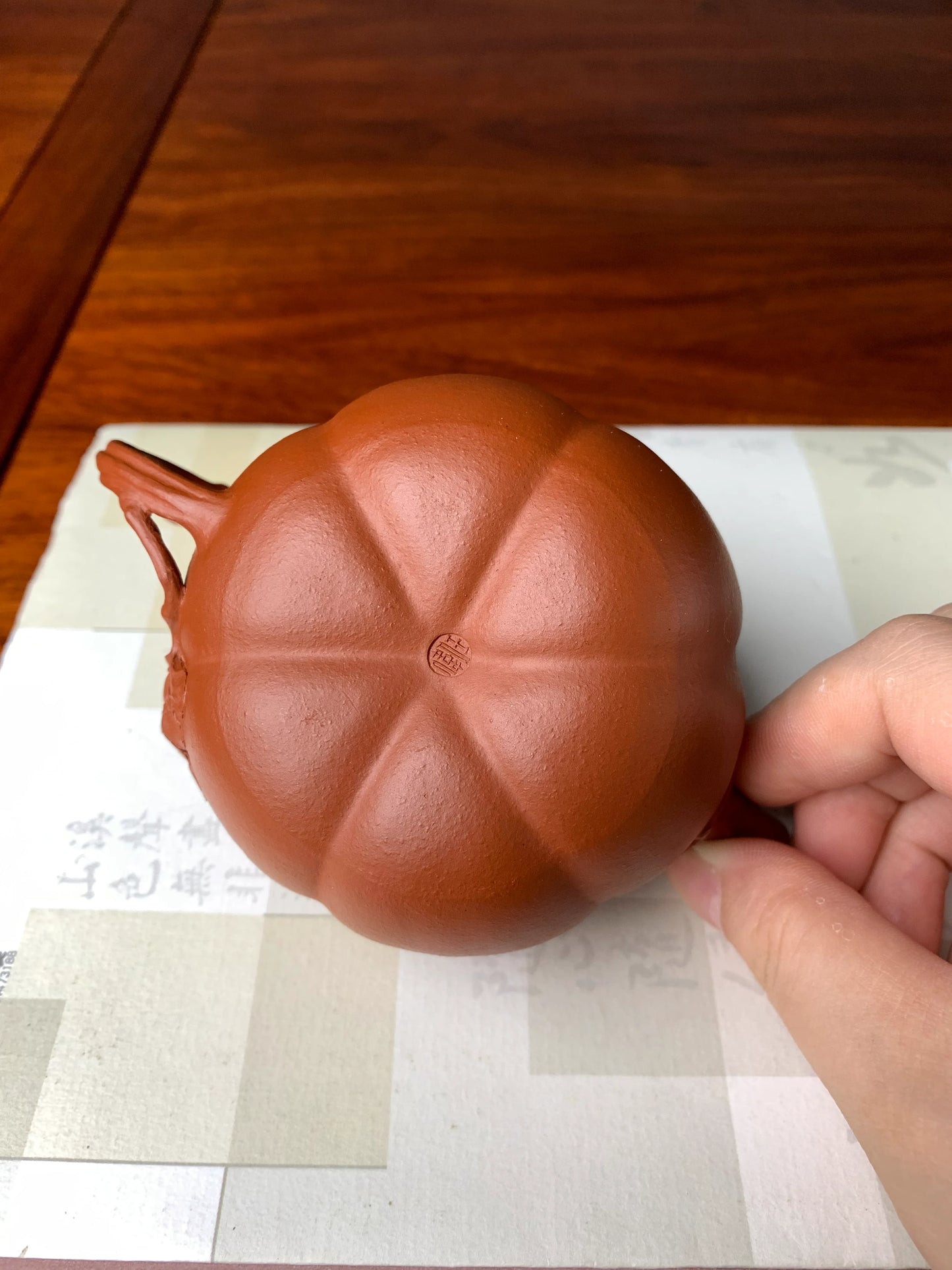 the teapot bottom of the collectible teapot named pumpkin