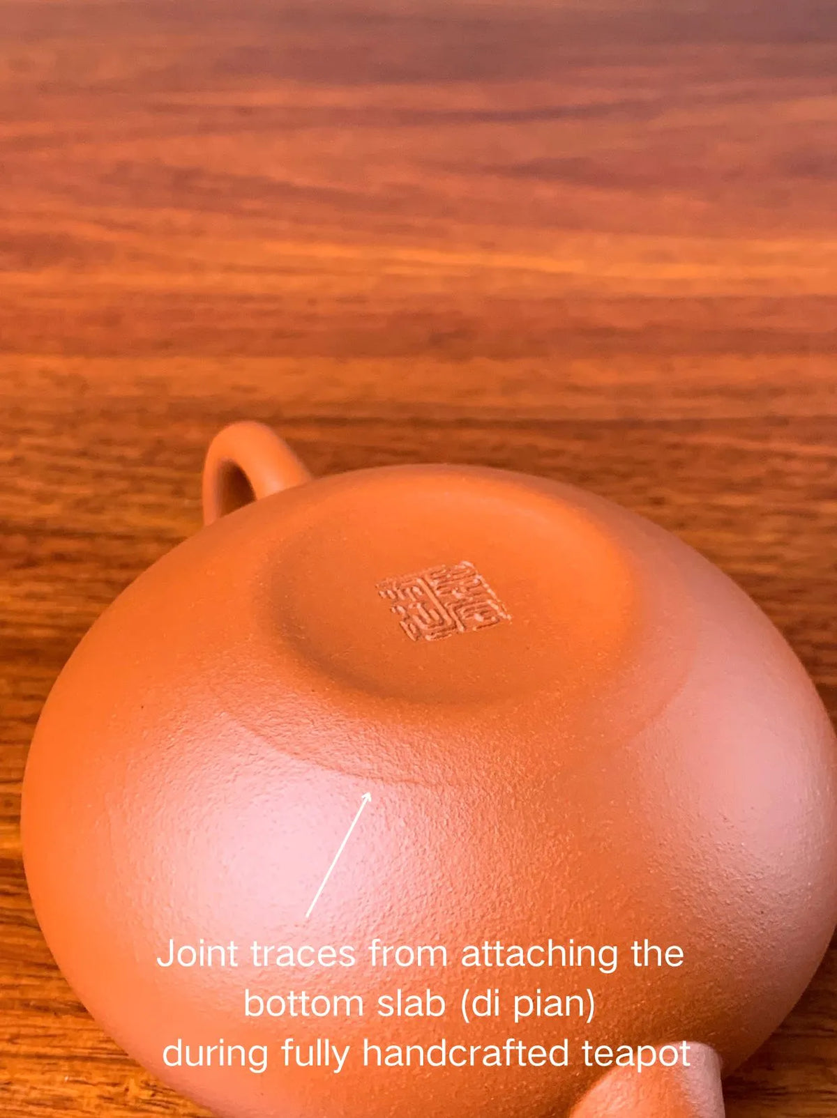 Joint traces from attaching the bottom slab (di pian) during fully handcrafted teapot.