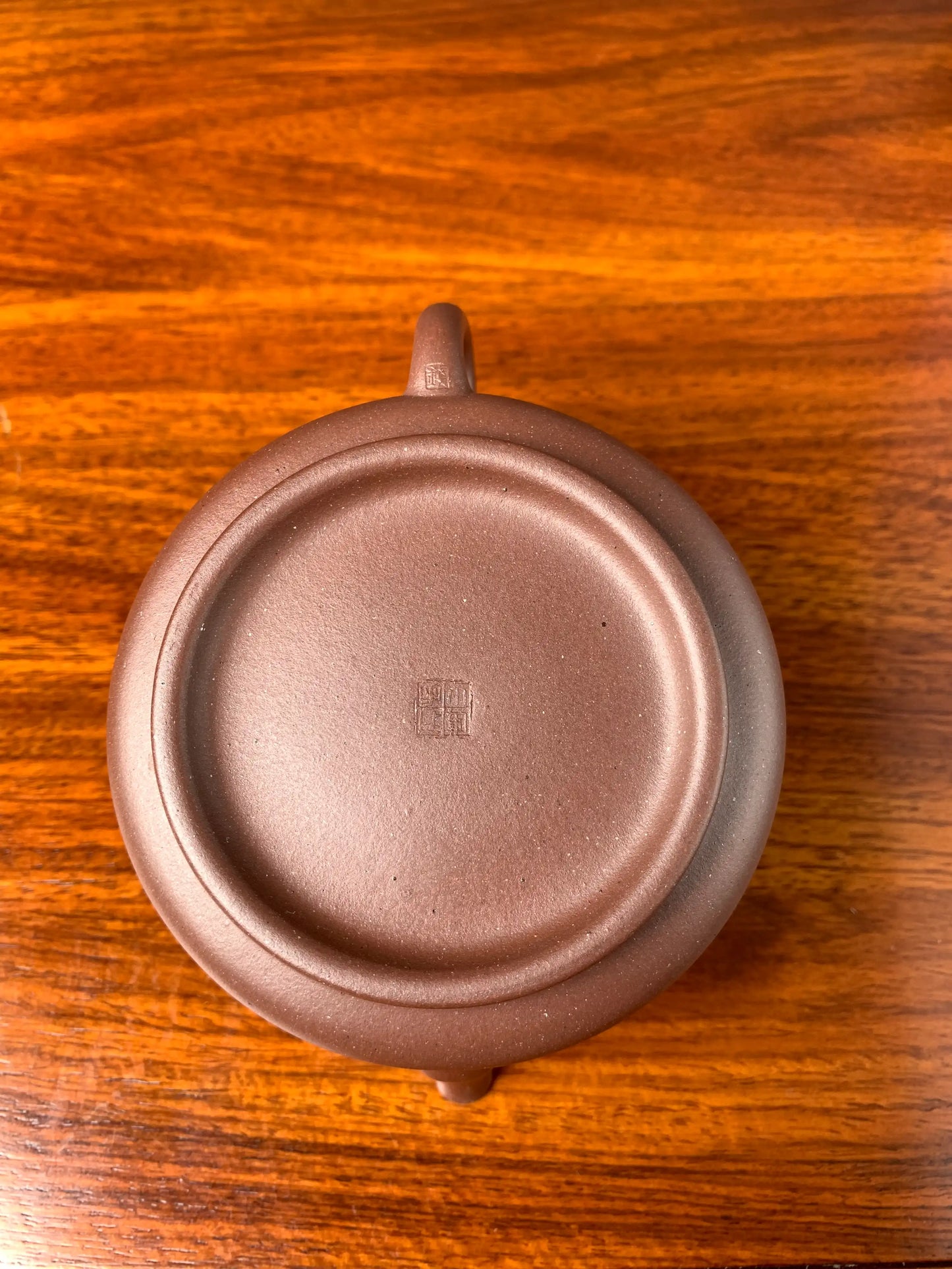 Looking down at the seal on the bottom of the collectible teapot