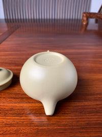 The marks of the bottom slab from the fully handcrafted teapot are clearly visible.