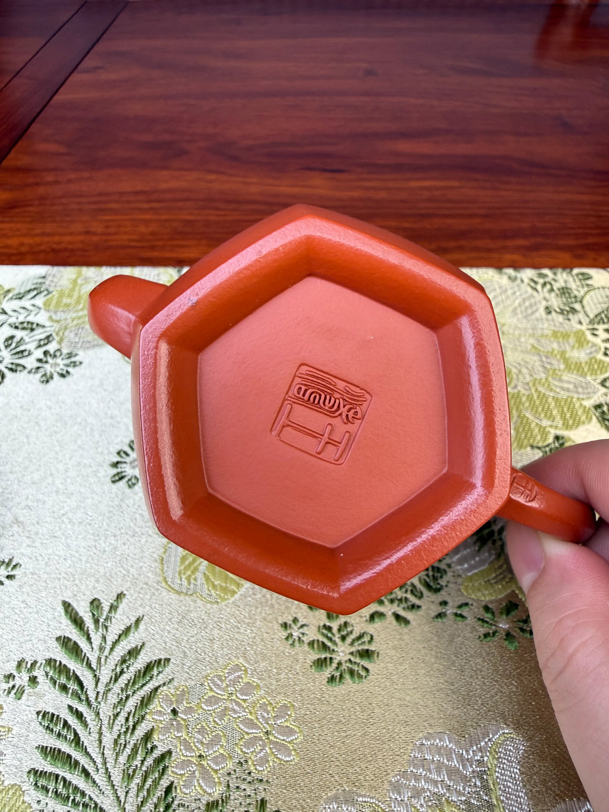 Take a close look at potter Wang Tao’s mark on the bottom of the teapot.