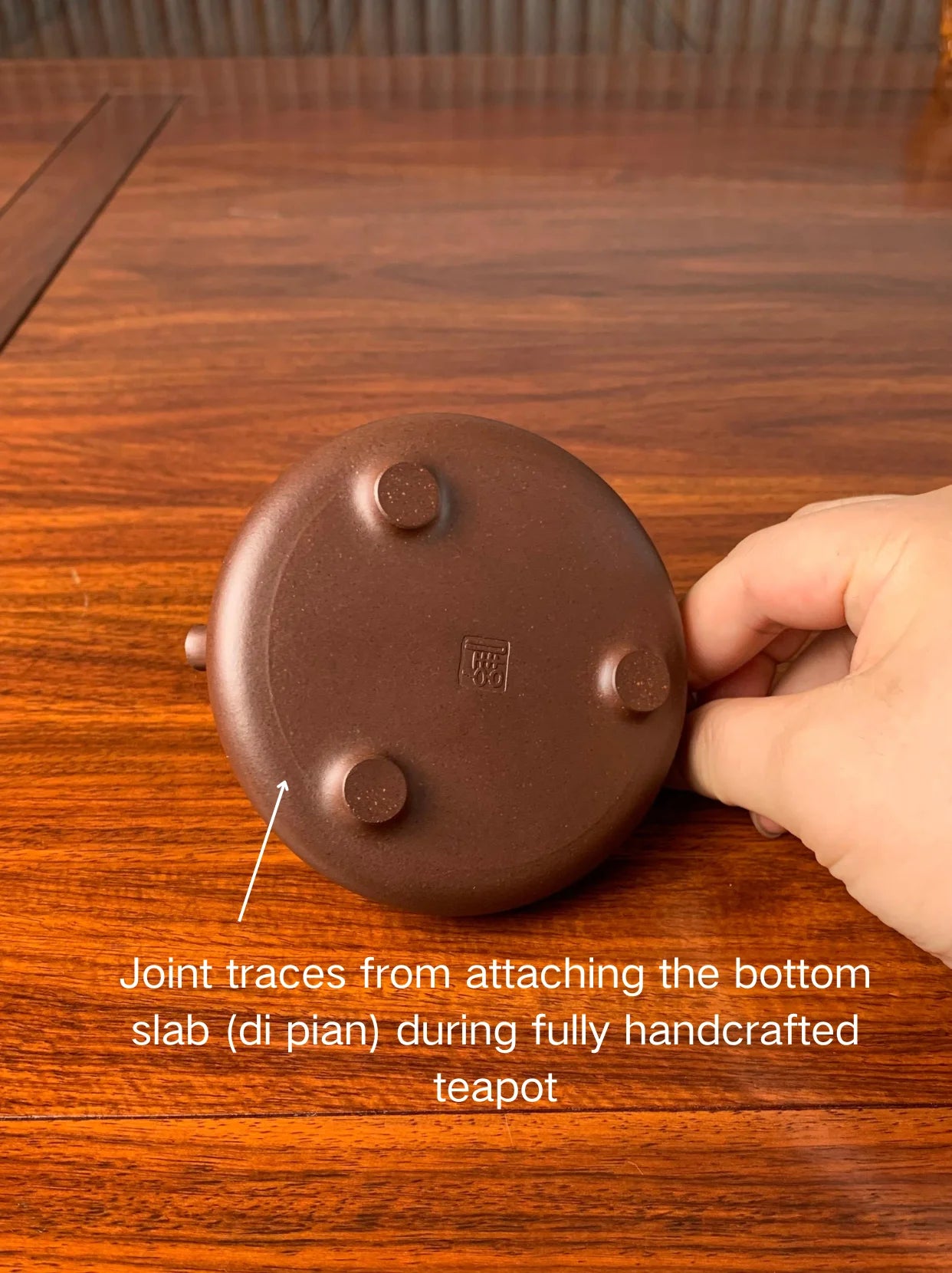 Joint traces from attaching the bottom slab (di pian) during fully handcrafted teapot.