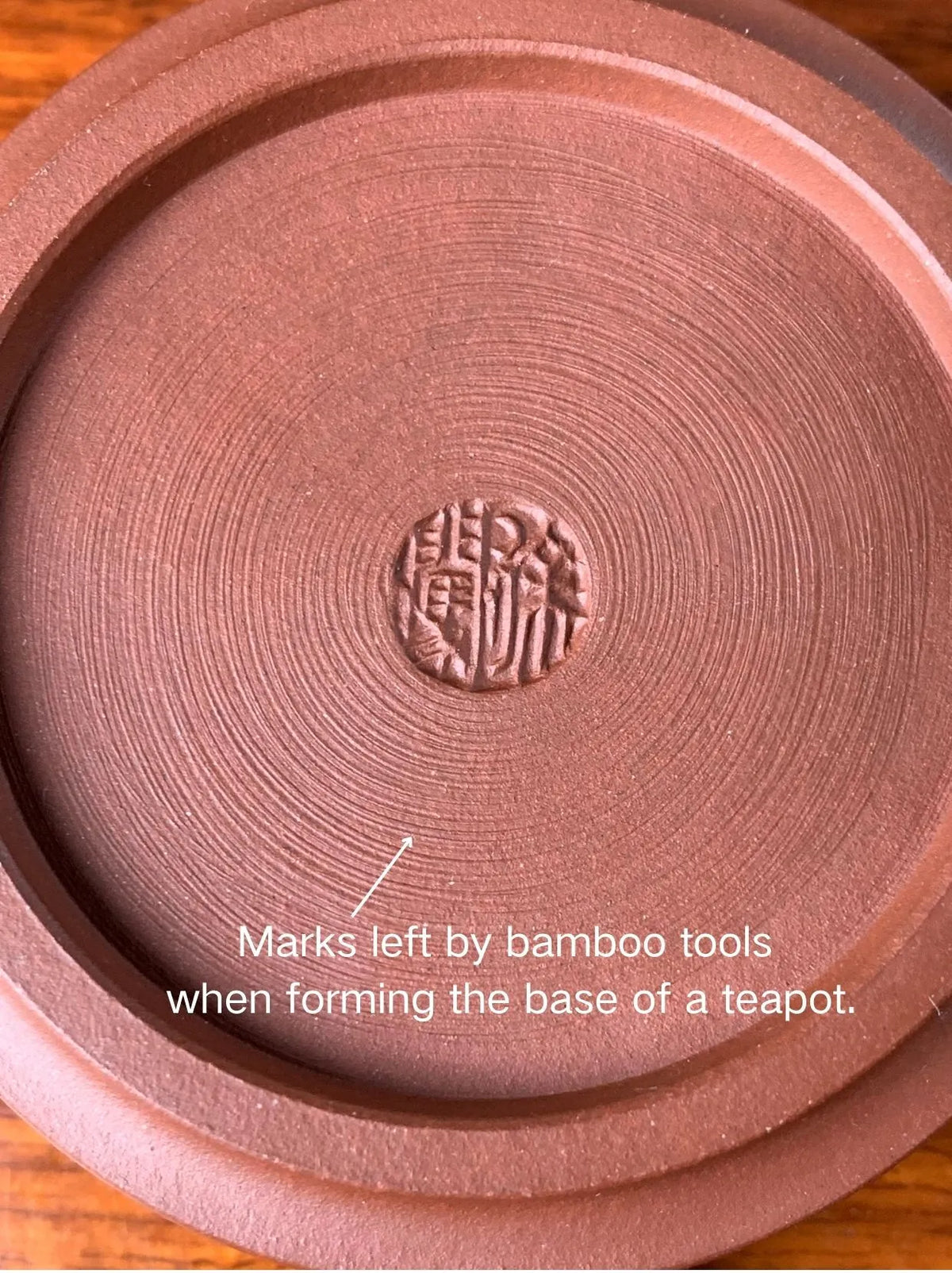 the teapot mark of potter xu chuang on the teapot bottom