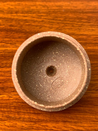 lid marks of the handmade yixing teapot on the table
