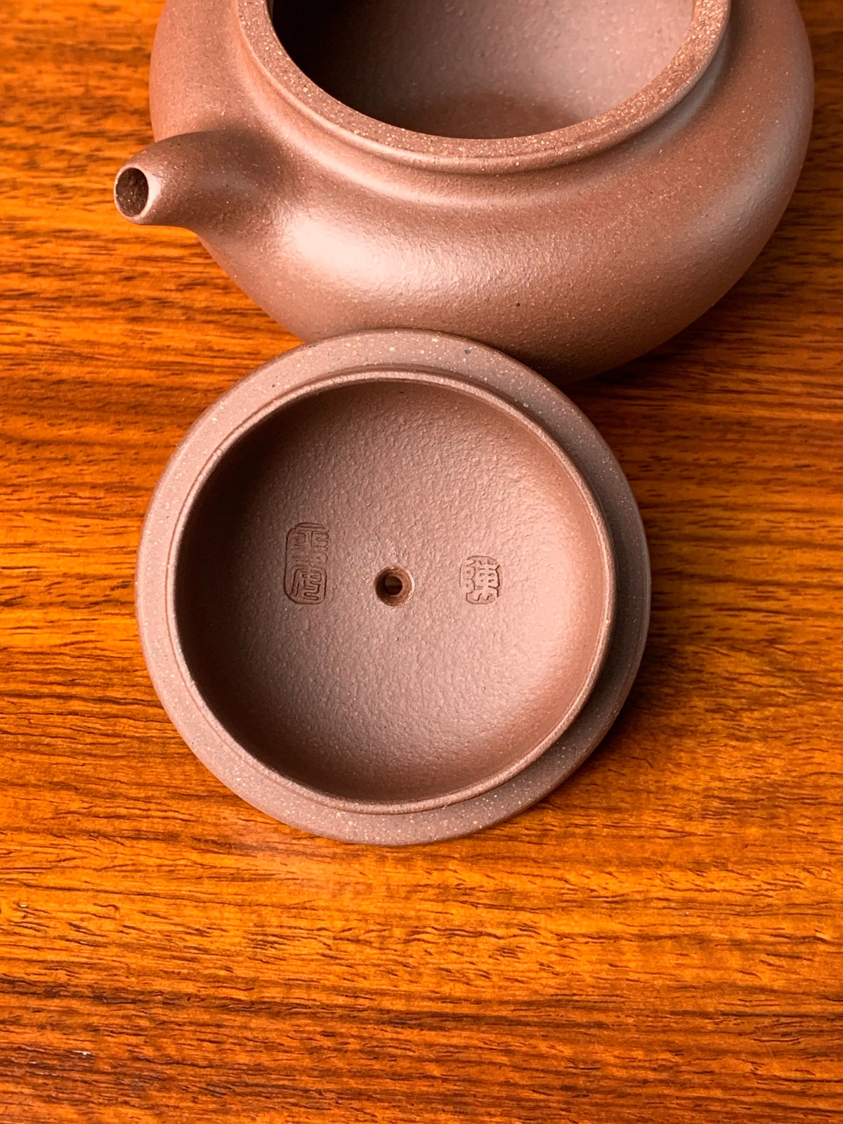 there are two teapot marks from potter chen ping an in the teapot lid