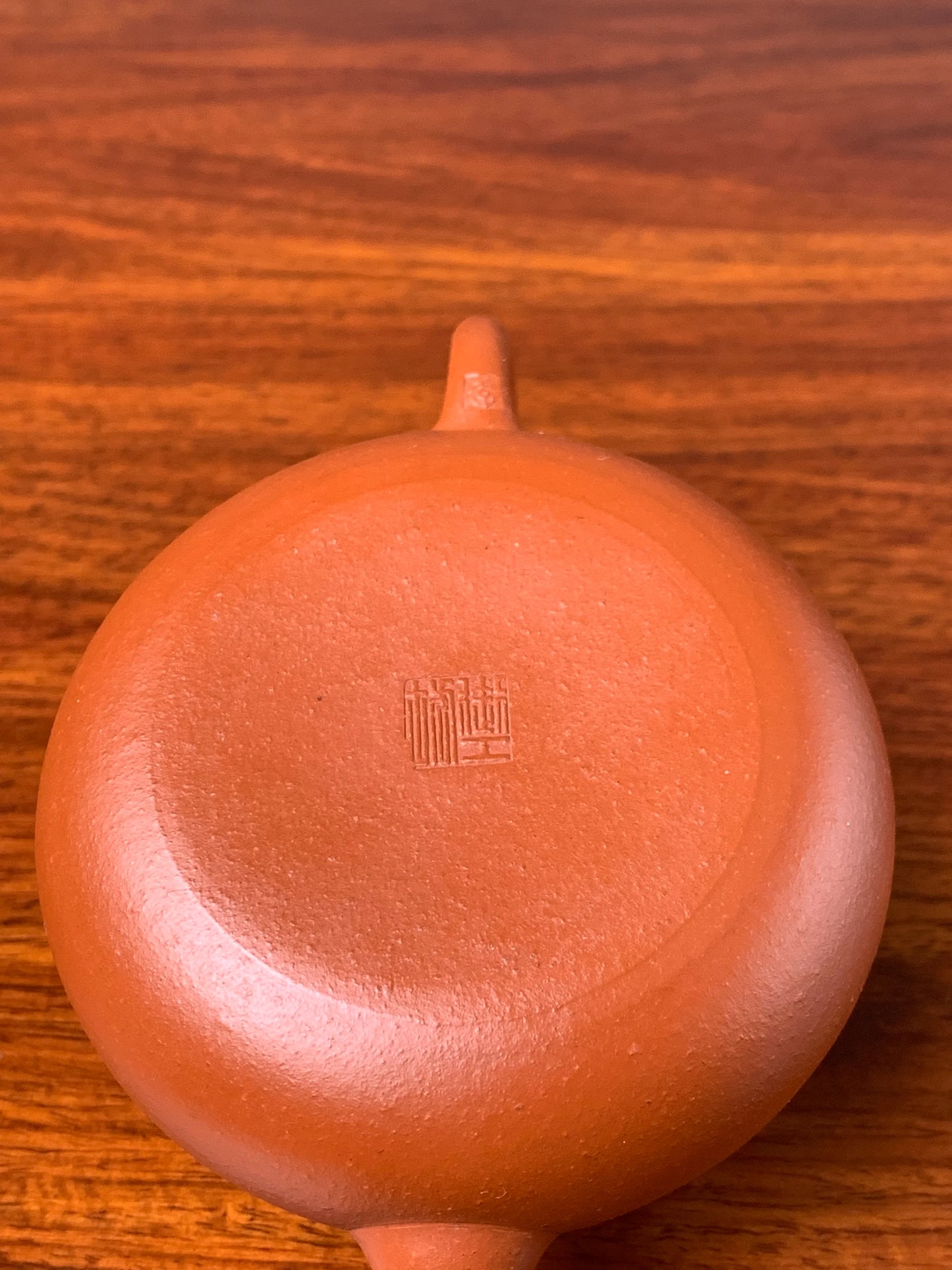 A close up photo of the bottom of this handmade teapot