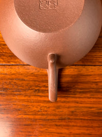 a teapot mark of tang on the handle