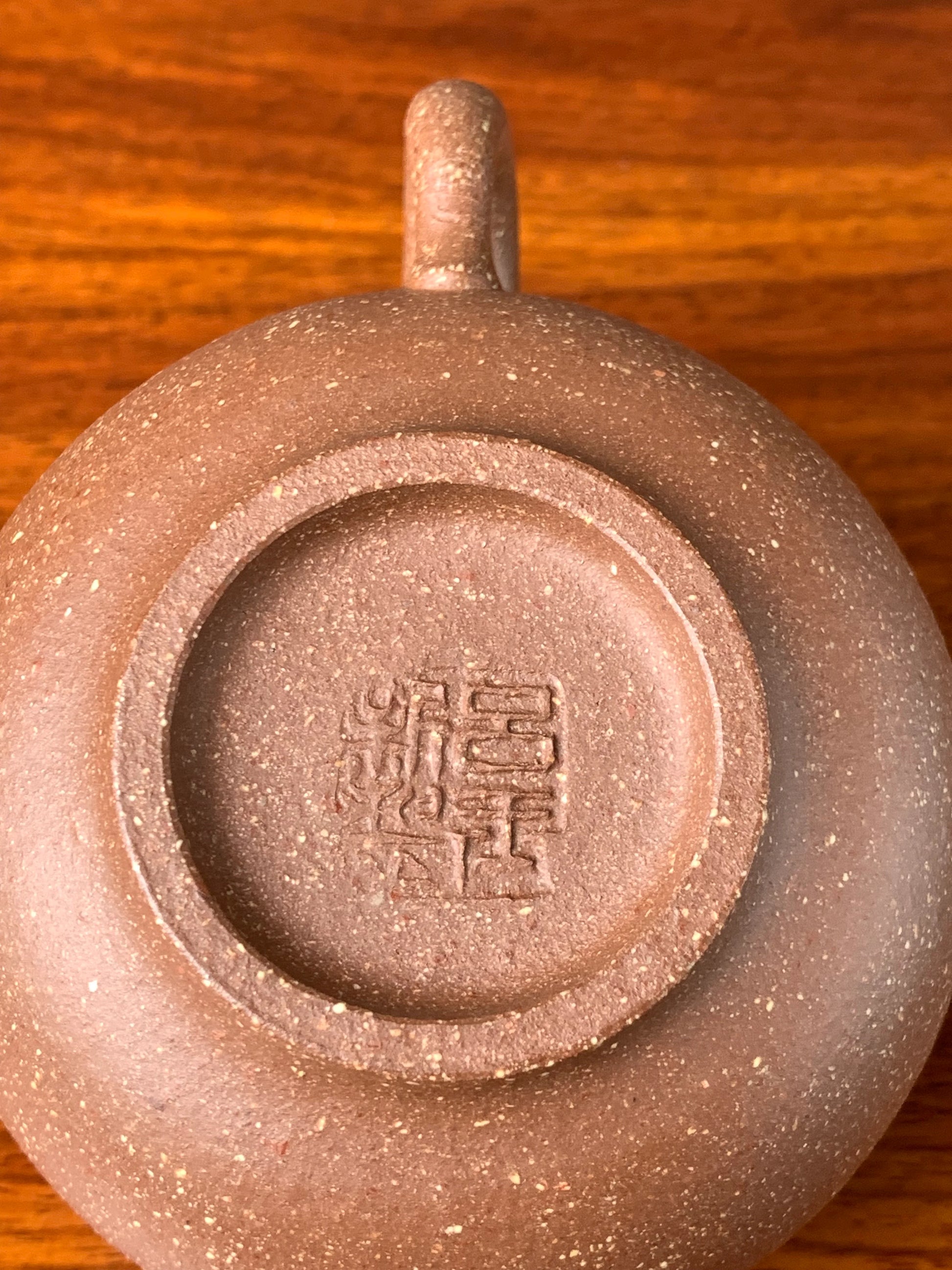 There is an artist's seal on the bottom of the teapot