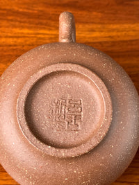 There is an artist's seal on the bottom of the teapot