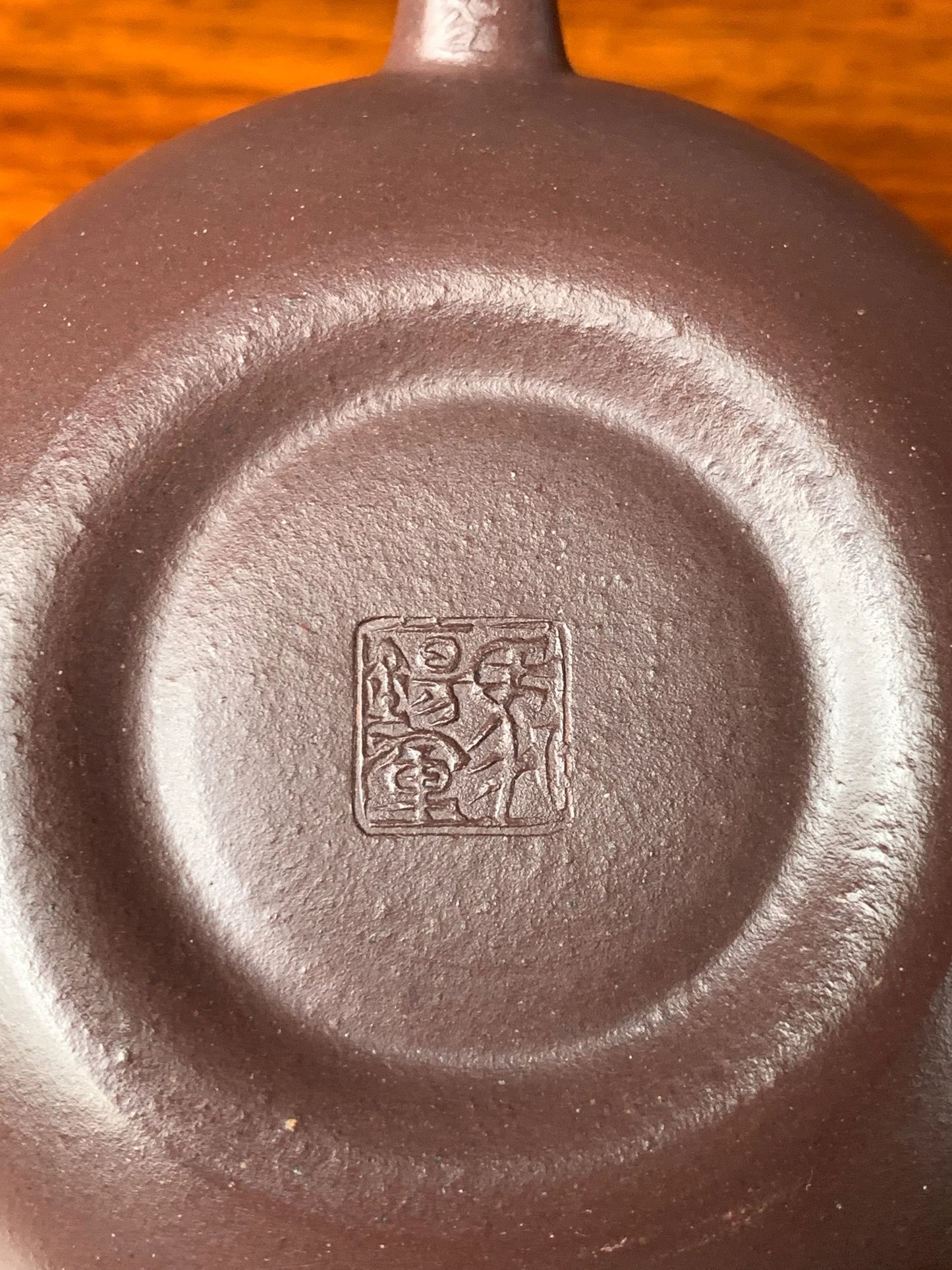 You can see artist Ma Xijun's seal on the bottom of the teapot