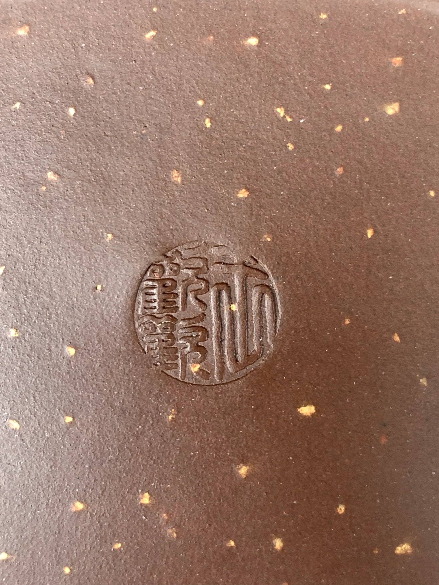 the yixing teapot mark of wang huanhuan on the bottom