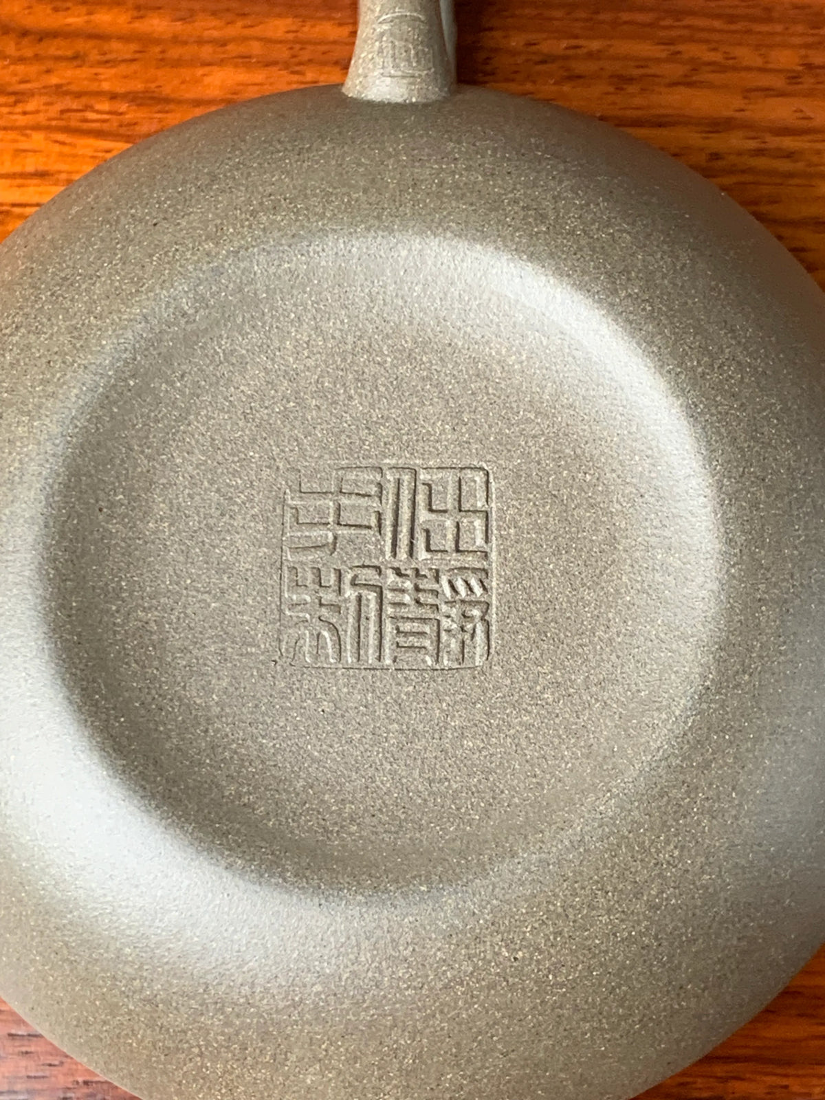The seal of the artist Jing Ren on the teapot bottom.