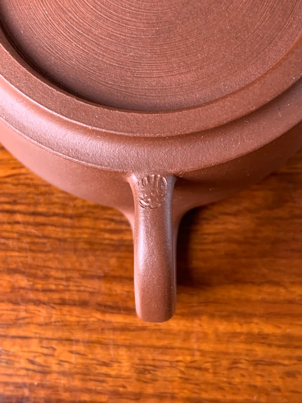 the teapot mark of potter xu on the handle