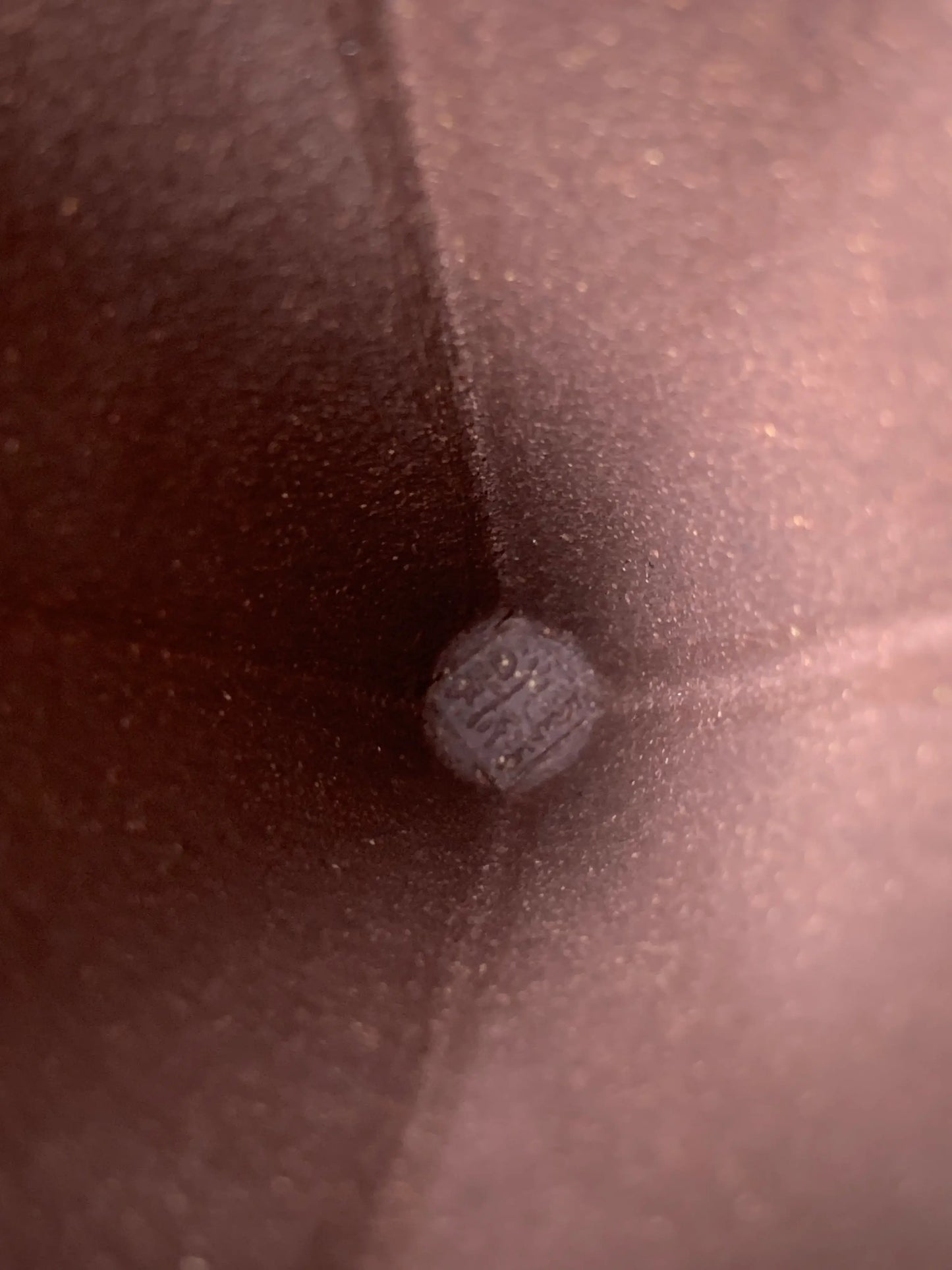 Detail of the artist's seal on the interior of the flared vintage teacup