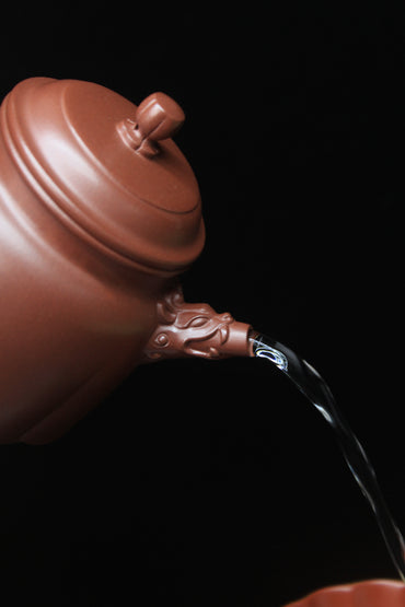 Pour of Vintage teapot come from zisha art gallery handmade with purple clay 