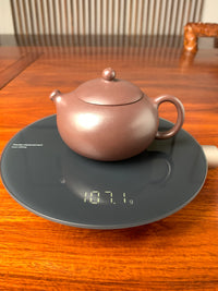 the weight of the xi shi teapot is 107g