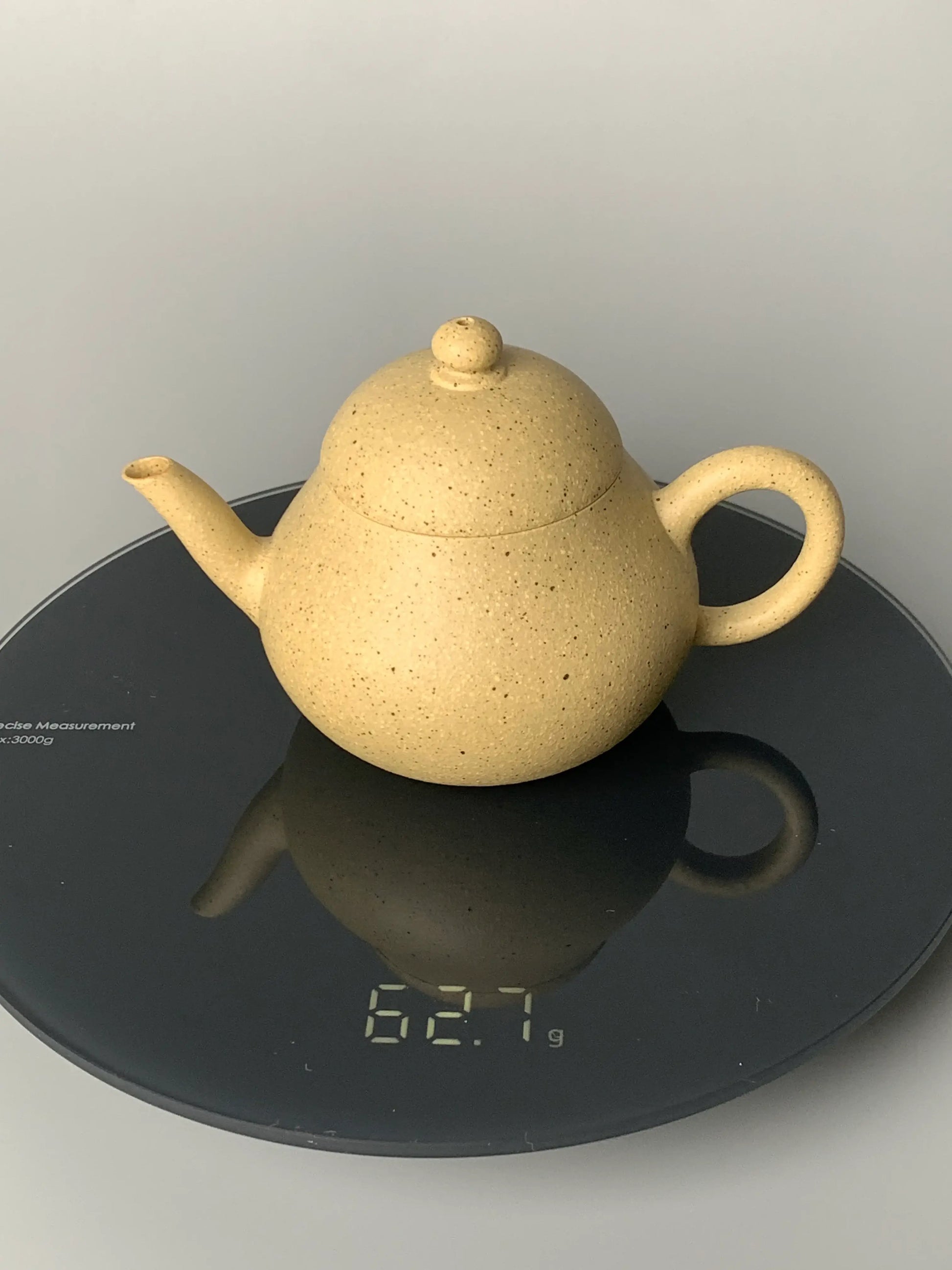 This is the weight of Yixing teapot is 62.7 grams