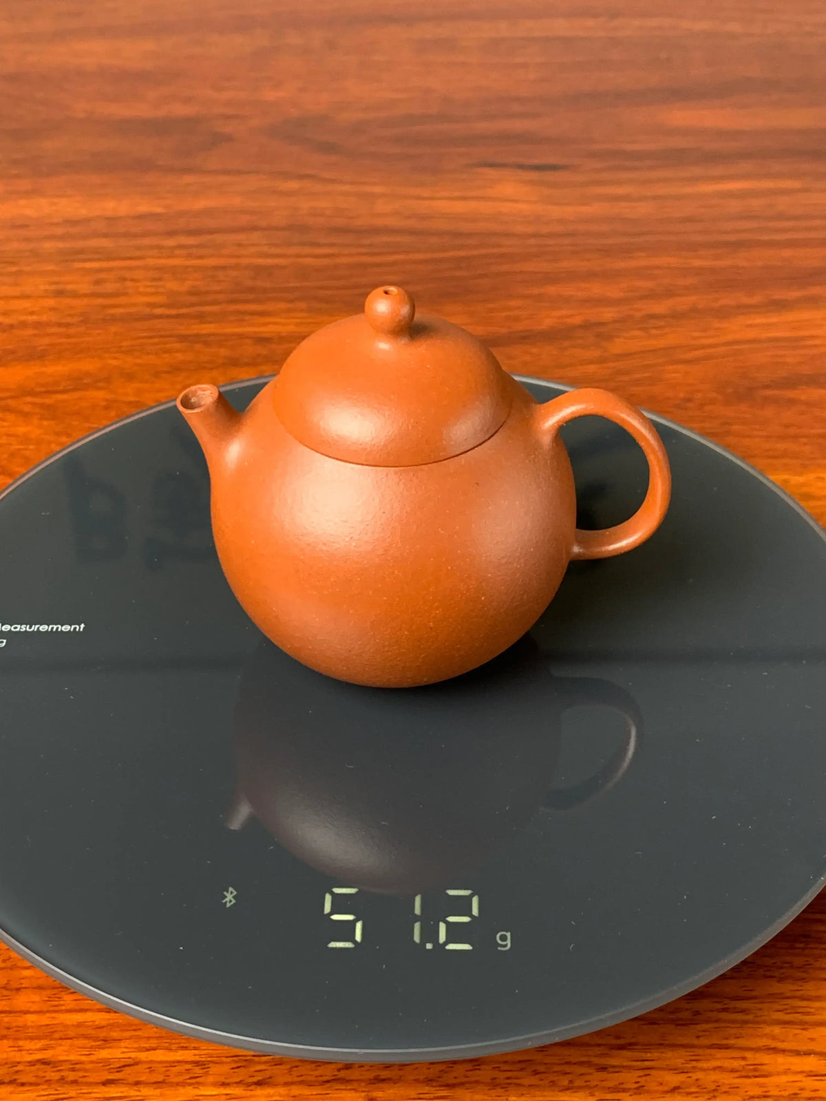 the weight of the small yixing teapot is 51.2g