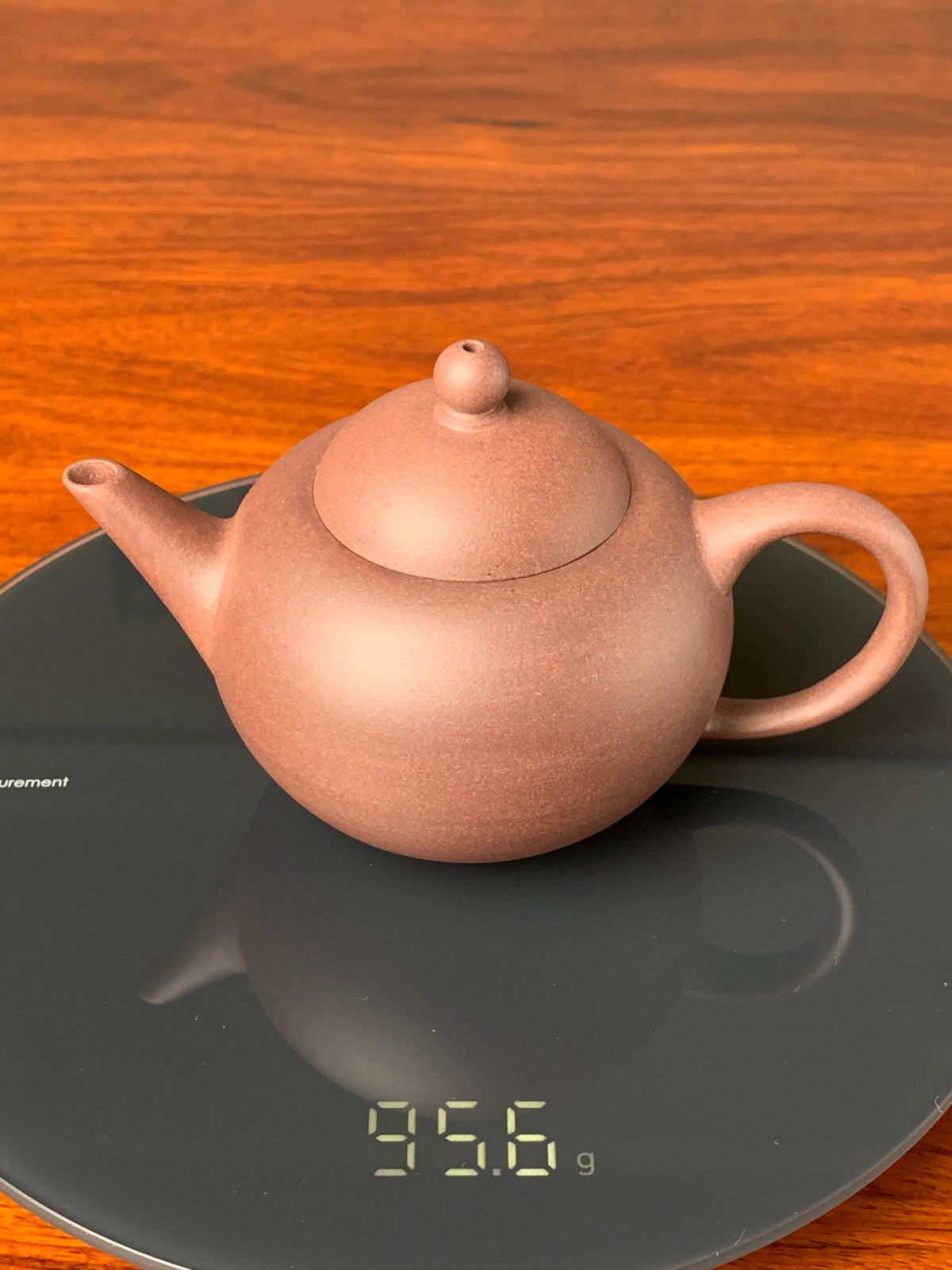 the weight of the yixing zisha clay teapot shui ping is 95g