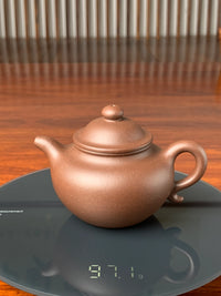 the weight of the yixing zisha clay teapot is 97g