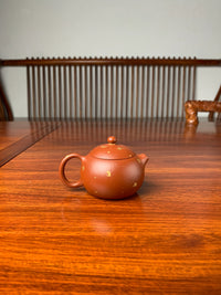 xishi yixing teapot on the table back view