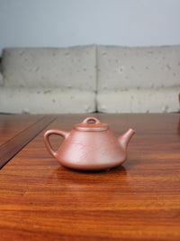 Back view of yi shing teapot, shi piao