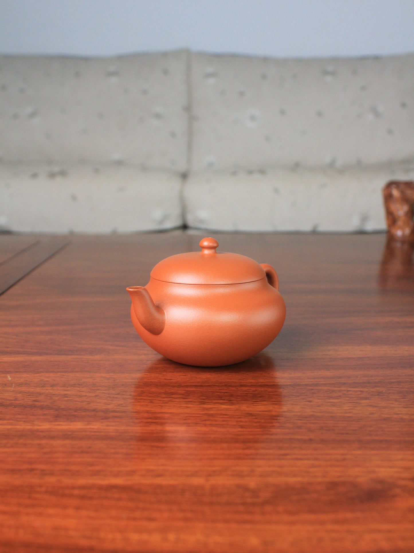 right of the yi shing teapot handmade with zisha zhu ni