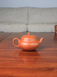 Back view of yi shing teapot, handmade with zisha clay