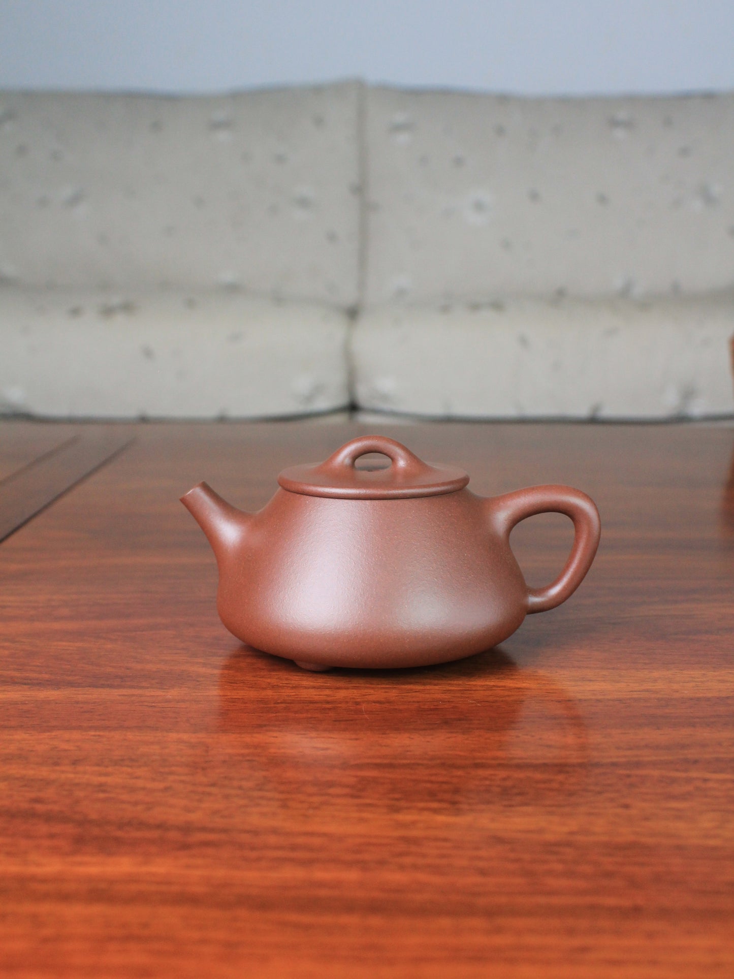 Front view of yi shing teapot shi piao handmade with yixing zisha