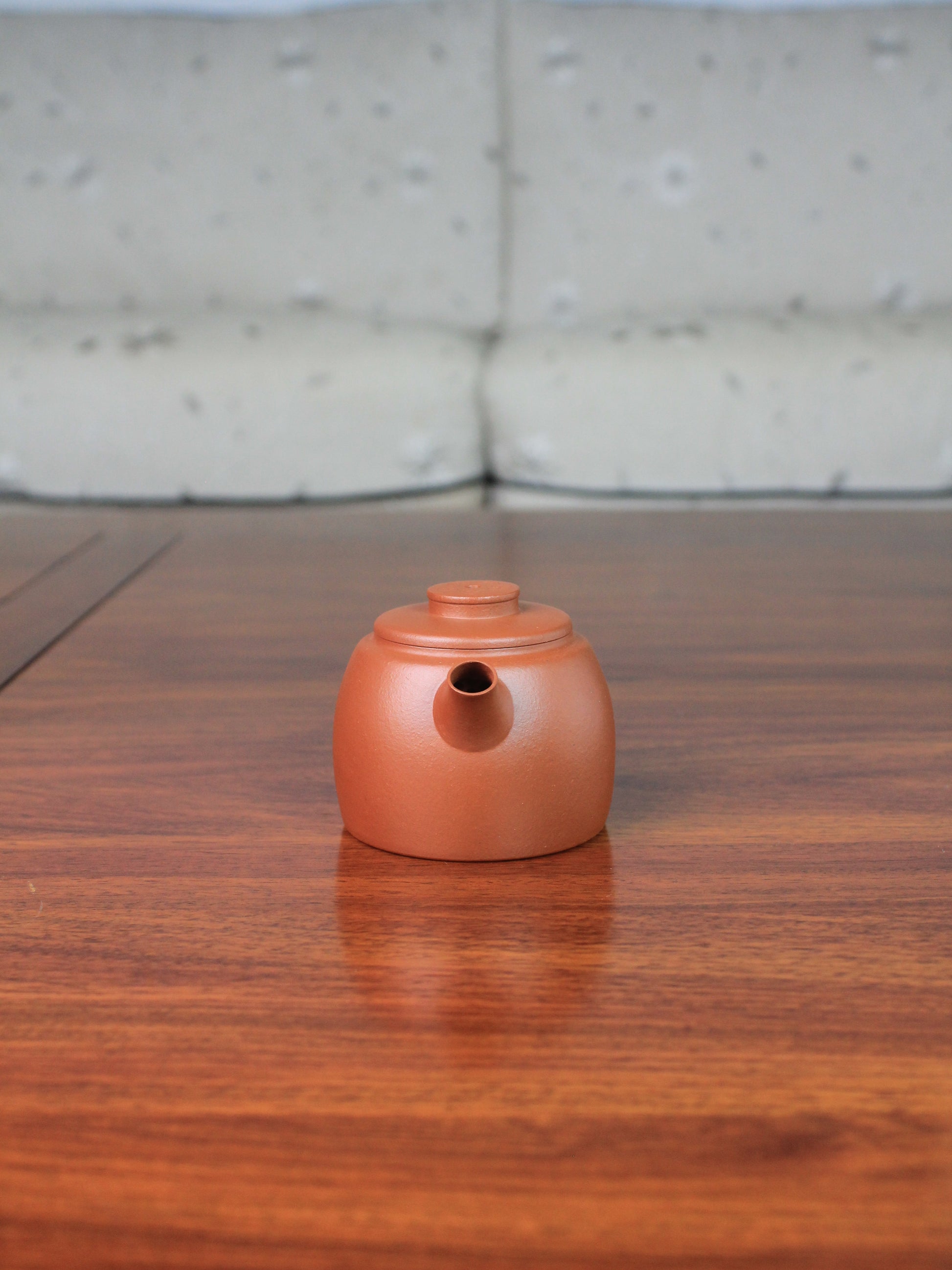 Front view of yi shing teapot named de zhong handmade with yixing clay