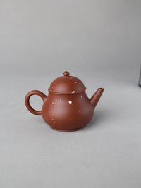 back view of yi shing teapot on the table