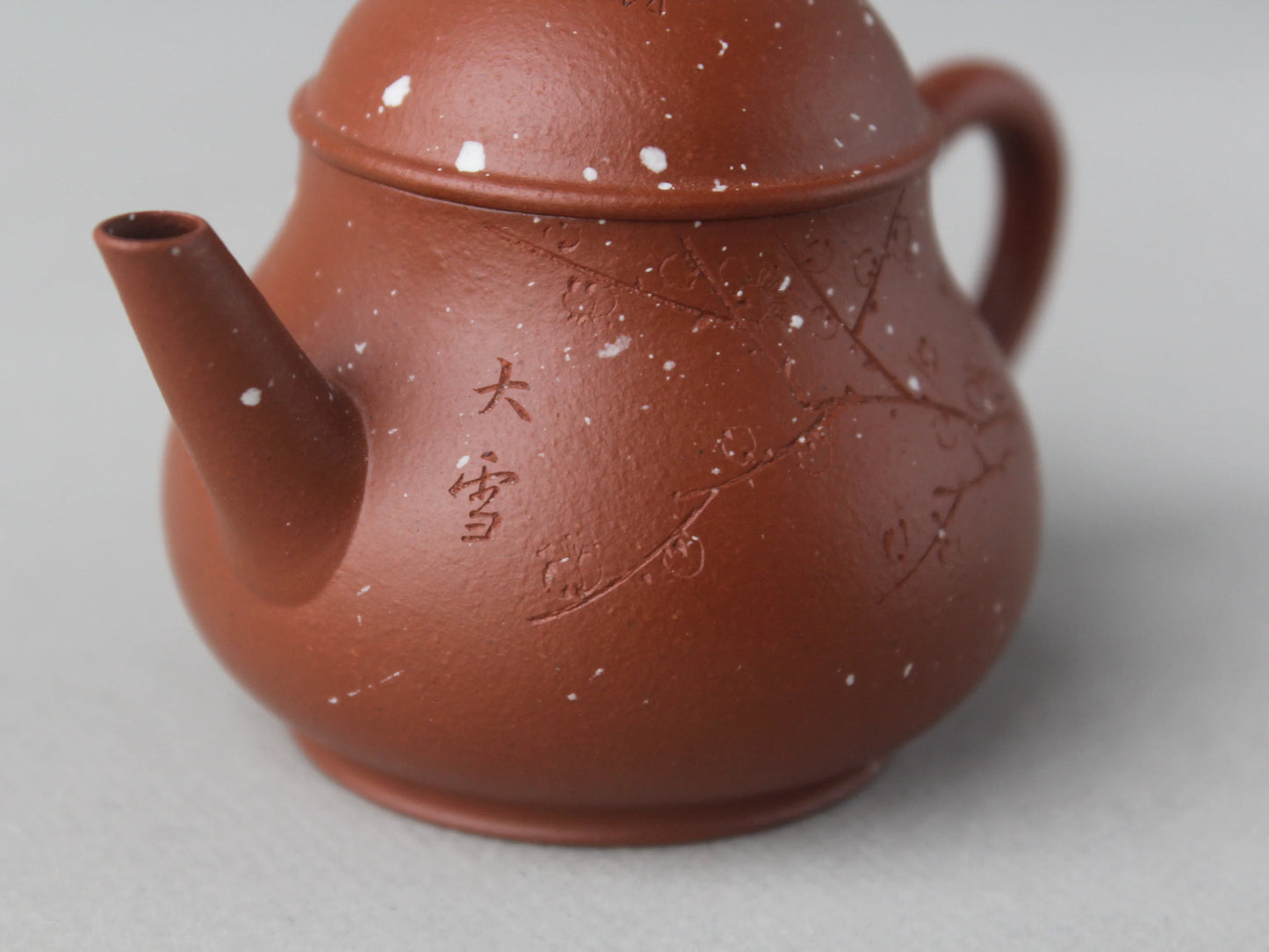 the detail of the yi shing teapot