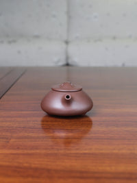 Front view of the Yi sing teapot shi piao fully handmade by teapot artist