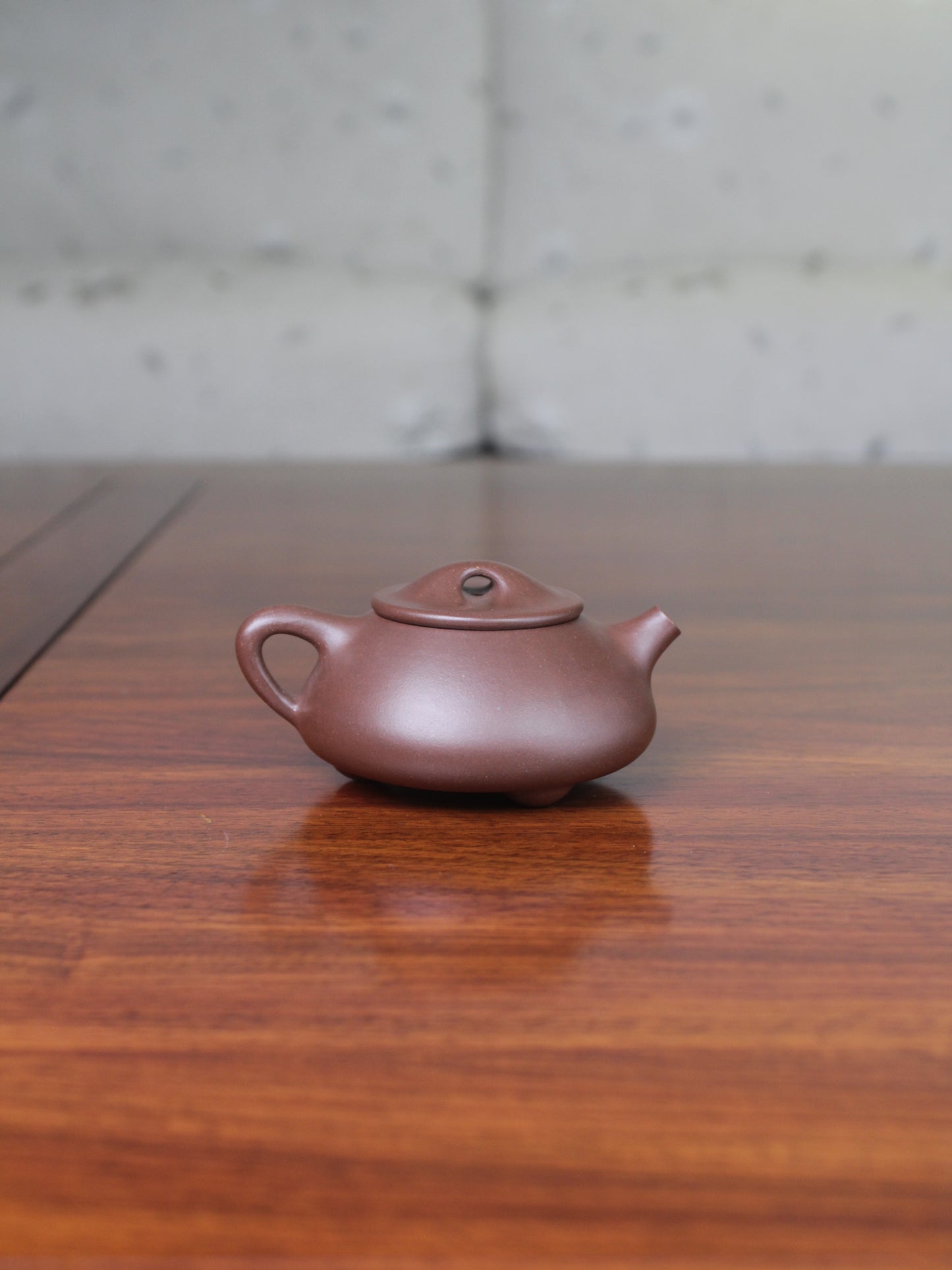 Back view of the Yi sing teapot shi piao fully handmade by teapot artist