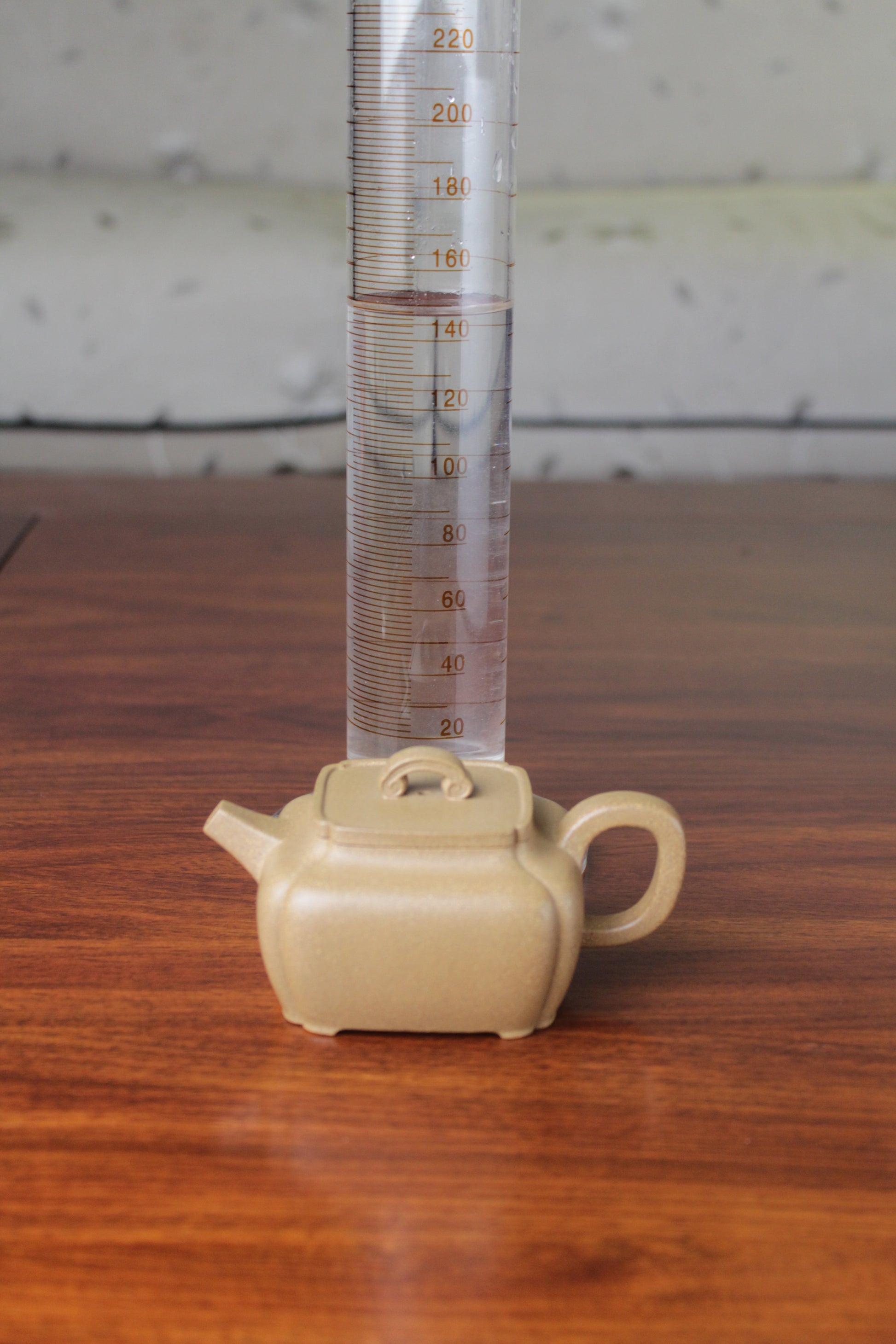Size of the yi xing tea pot handmade with purple clay on the table