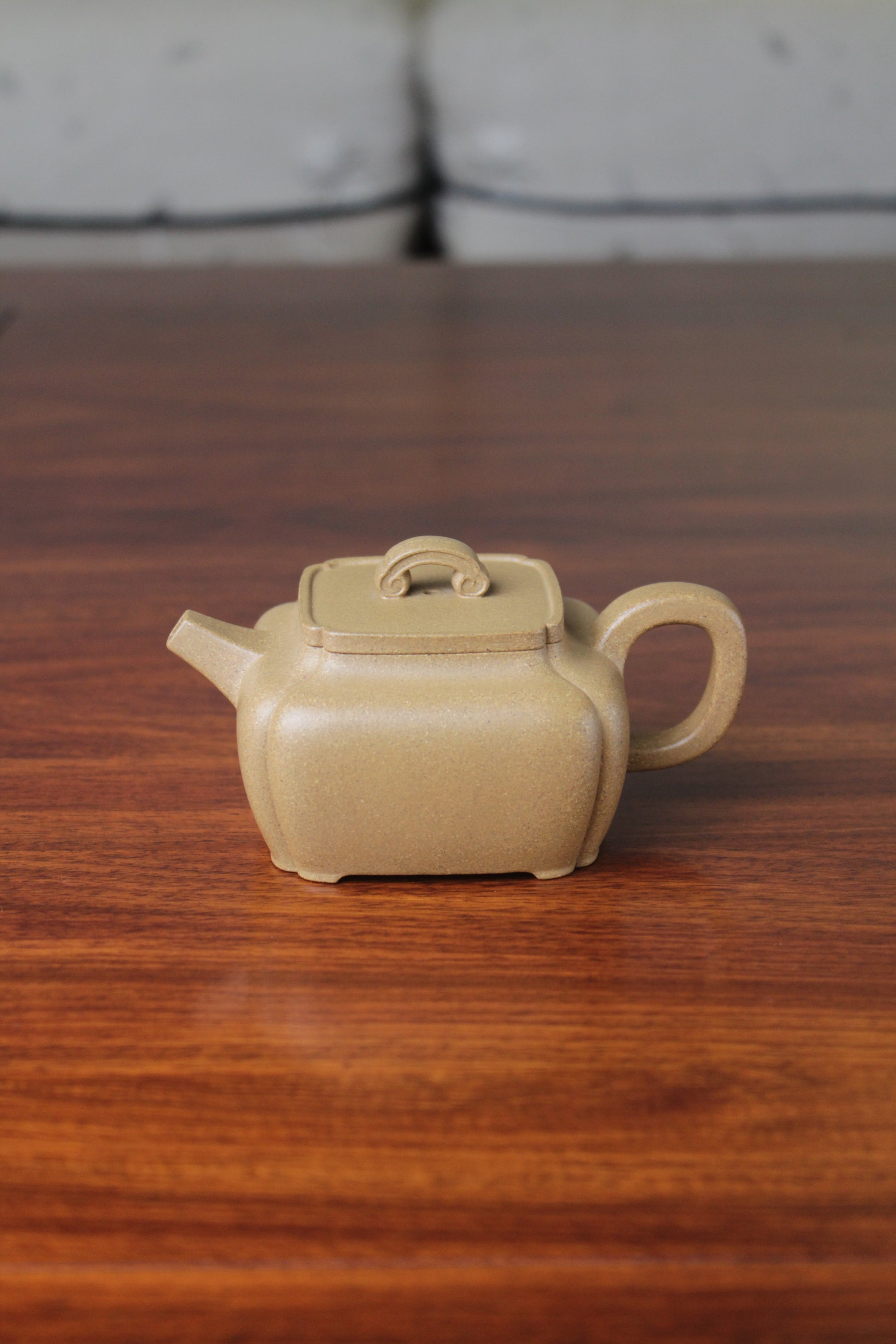 yi xing tea pot handmade with purple clay on the table
