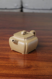 Right of the yi xing tea pot handmade with purple clay on the table