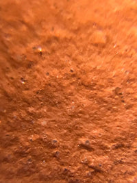Magnified image of aged lao zhuni clay: the premium raw material used for teapot