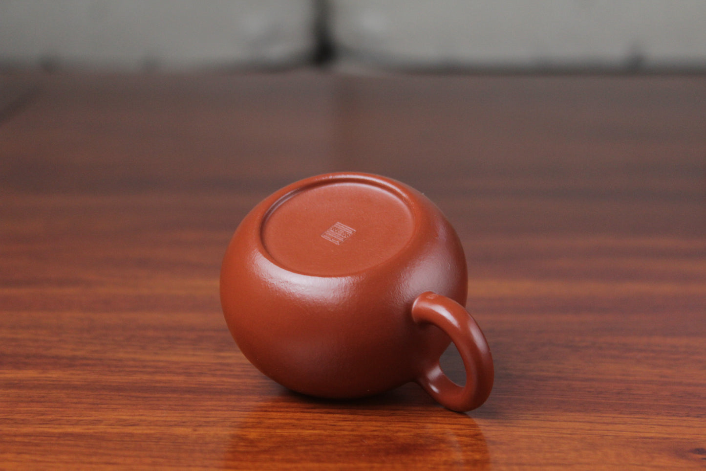 bottom of the yixing clay teapot xishi on the table