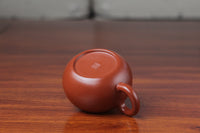 bottom of the yixing clay teapot xishi on the table