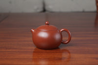 Front of tthe yixing clay teapot xishi on the table