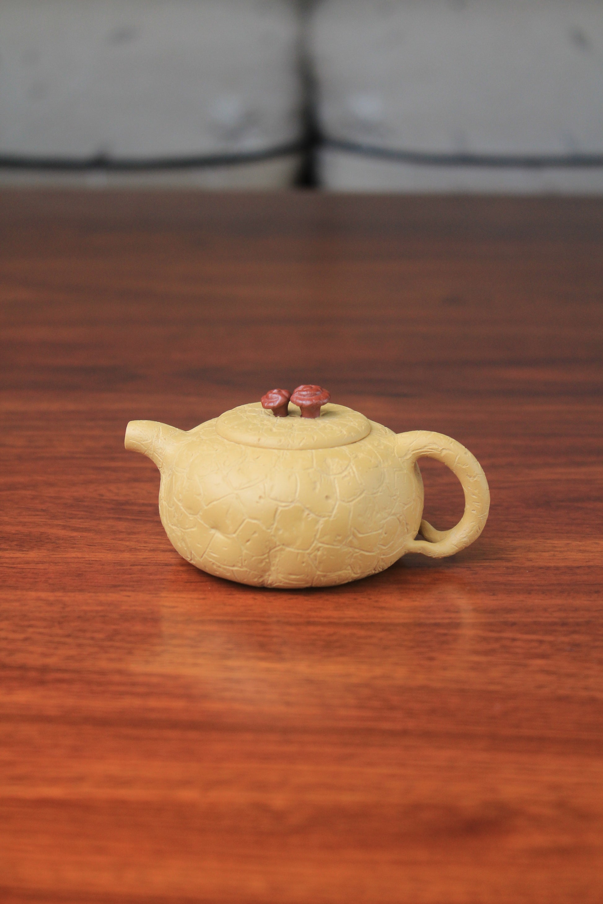 The front of the yixing clay teapot on the table