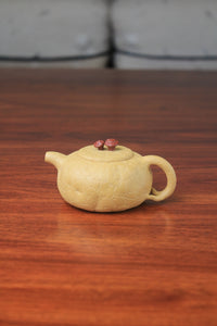 The front of the yixing clay teapot on the table