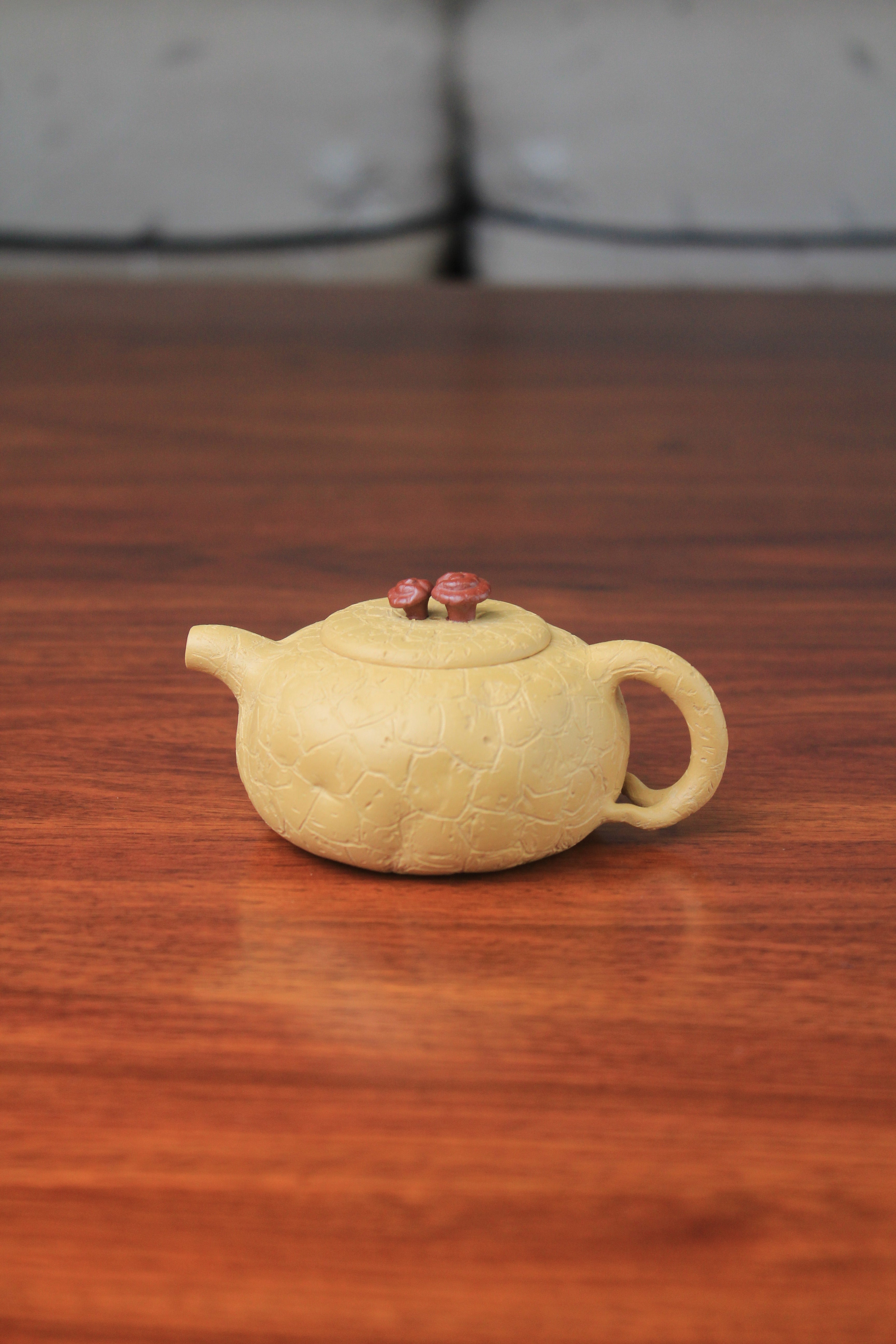The front of the yixing clay teapot on the table