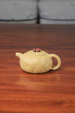 The front of the yixing clay teapot on the table